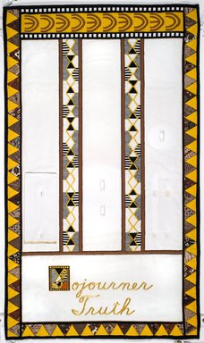 Judy Chicago (American, born 1939). <em>Sojourner Truth Place Setting</em>, 1974-1979. Runner: Cotton/linen base fabric, muslin, flannel, cotton twill tape, silk, synthetic gold cord, cotton triangles, tapestry woven bands, cotton bias tape, cotton floss, thread
Plate: Porcelain with overglaze enamel (China paint), rainbow luster glaze, and paint, Runner: 51 5/8 x 30 1/8 in. (131.1 x 76.5 cm). Brooklyn Museum, Gift of The Elizabeth A. Sackler Foundation, 2002.10-PS-31. © artist or artist's estate (Photo: , 2002.10-PS-31_runner_PS1.jpg)