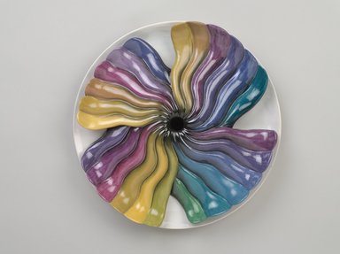 Judy Chicago (American, born 1939). <em>Elizabeth Blackwell Place Setting</em>, 1974-1979. Runner: Cotton/linen base fabric, woven interface support material (horsehair, wool, and linen), cotton twill tape, silk, synthetic gold cord, colored cotton, cotton fabric, chiffon, cotton, metallic cord, silk threads, cotton thread
Plate: Porcelain with overglaze enamel (China paint), Runner: 51 7/8 x 31 in. (131.8 x 78.7 cm). Brooklyn Museum, Gift of The Elizabeth A. Sackler Foundation, 2002.10-PS-33. © artist or artist's estate (Photo: Brooklyn Museum, 2002.10-PS-33_plate_PS9.jpg)