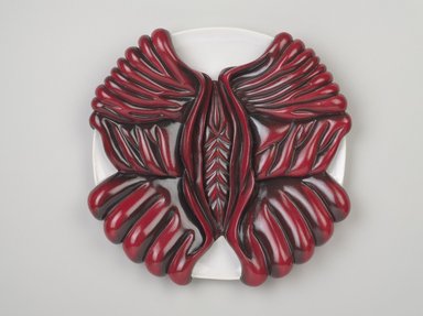 Judy Chicago (American, born 1939). <em>Margaret Sanger Place Setting</em>, 1974–1979. Runner: Silk satin, cotton/linen base fabric, woven interface support material (horsehair, wool, and linen), cotton twill tape, silk, synthetic gold cord, silk thread
Plate: Porcelain (possibly stoneware), overglaze enamel (China paint), paint, Runner: 51 1/4 x 31 7/8 in. (130.2 x 81 cm). Brooklyn Museum, Gift of The Elizabeth A. Sackler Foundation, 2002.10-PS-36. © artist or artist's estate (Photo: Brooklyn Museum, 2002.10-PS-36_plate_PS9.jpg)