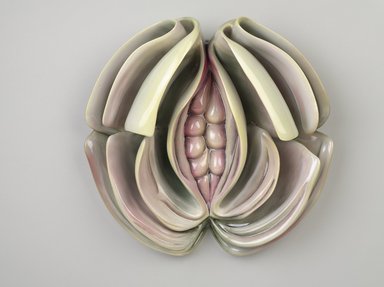 Judy Chicago (American, born 1939). <em>Virginia Woolf Place Setting</em>, 1974-1979. Runner: Cotton/linen base fabric, woven interface support material (horsehair, wool, and linen), cotton twill tape, silk, synthetic gold cord, airbrushed acrylic paint, silk chiffon, silk embroidery thread,
Plate: Porcelain with overglaze enamel (China paint), Runner: 52 x 30 1/8 in. (132.1 x 76.5 cm). Brooklyn Museum, Gift of The Elizabeth A. Sackler Foundation, 2002.10-PS-38. © artist or artist's estate (Photo: Brooklyn Museum, 2002.10-PS-38_plate_PS9.jpg)