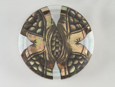 Judy Chicago (American, born 1939). <em>Ishtar Place Setting</em>, 1974-1979. Runner:Cotton/linen base fabric, woven interface support material (horsehair, wool, and linen), cotton twill tape, silk, synthetic gold cord, silk satin, flannel, felt, soutache, silk thread
Plate:Porcelain with overglaze enamel (China paint), metallic glaze, rainbow luster, Runner:51 1/4 x 29 3/4 in. (130.2 x 75.6 cm). Brooklyn Museum, Gift of The Elizabeth A. Sackler Foundation, 2002.10-PS-3. © artist or artist's estate (Photo: Brooklyn Museum, 2002.10-PS-3_plate_PS9.jpg)
