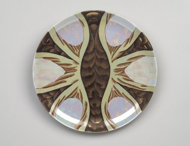 Judy Chicago (American, born 1939). <em>Snake Goddess Place Setting</em>, 1974-1979. Runner:Cotton/linen base fabric, woven interface support material (horsehair, wool, and linen), cotton twill tape, silk, synthetic gold cord, Japanese cord, Maltese silk thread, DMC cotton embroidery floss, thread
Plate:Porcelain with overglaze enamel (China paint), rainbow overglaze, gold metallic glaze, Runner: 51 1/2 x 31 in. (130.8 x 78.7 cm). Brooklyn Museum, Gift of The Elizabeth A. Sackler Foundation, 2002.10-PS-5. © artist or artist's estate (Photo: Brooklyn Museum, 2002.10-PS-5_plate_PS9.jpg)