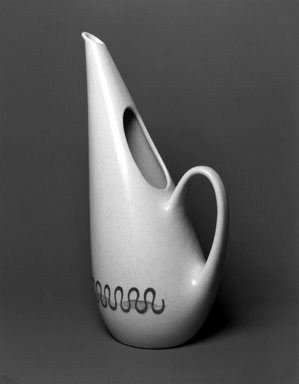 (of shape) Frank Irwin (American, 20th century). <em>Pitcher, Poppytrail Line, Freeform Shape, California Aztec Pattern</em>, shape introduced 1954; design introduced 1955. Glazed earthenware, 14 3/8 x 8 x 5in. (36.5 x 20.3 x 12.7cm). Brooklyn Museum, Gift of Robert Tuggle, 2002.17.1. Creative Commons-BY (Photo: Brooklyn Museum, 2002.17.1_bw.jpg)