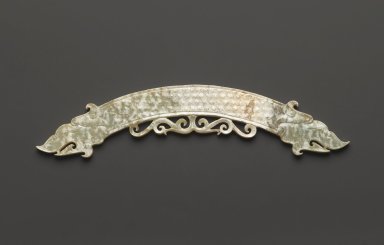  <em>Arc-shaped Pendant (Huang)</em>, 20th century. Greenish nephrite, 9 x 1 3/8 x 1/4 in. (22.9 x 3.5 x 0.6 cm). Brooklyn Museum, Gift of Mr. and Mrs. Raymond Hargreaves, 2002.36.1. Creative Commons-BY (Photo: Brooklyn Museum, 2002.36.1_side1_PS2.jpg)