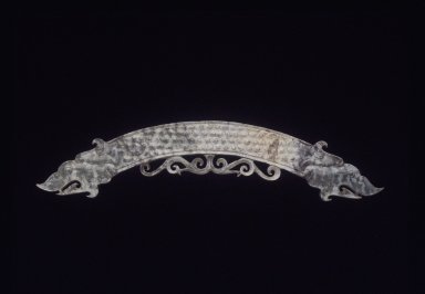  <em>Arc-shaped Pendant (Huang)</em>, 20th century. Greenish nephrite, 9 x 1 3/8 x 1/4 in. (22.9 x 3.5 x 0.6 cm). Brooklyn Museum, Gift of Mr. and Mrs. Raymond Hargreaves, 2002.36.1. Creative Commons-BY (Photo: Brooklyn Museum, 2002.36.1_transp5684.jpg)