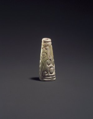  <em>Tapered Bead</em>, 20th century. Crystaline hardstone with white calcification, 1 3/8 x 9/16 in. (3.5 x 1.4 cm). Brooklyn Museum, Gift of Mr. and Mrs. Raymond Hargreaves, 2002.36.7. Creative Commons-BY (Photo: Brooklyn Museum, 2002.36.7_transp5683.jpg)
