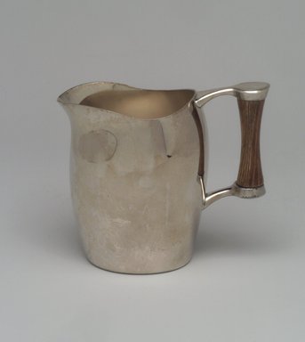 Niagra Falls Silver Co., a Division of Oneida Silversmiths (1877 to present). <em>Creamer, from Three Piece Coffee Service, Heirloom Line</em>, ca. 1955. Silverplate, wood, 4 1/4 x 5 x 2 7/8 in. (10.8 x 12.7 x 7.3 cm). Brooklyn Museum, Gift of Jewel Stern, 2003.11.3. Creative Commons-BY (Photo: Brooklyn Museum, 2003.11.3.jpg)