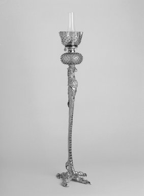 Pierre Emmanuel Guerin (American, born France, 1833-1911). <em>Floor Lamp</em>, Patented April 13, 1886. Brass, glass, iron, 51 1/4 x 11 x 13 in. (130.2 x 27.9 x 33 cm). Brooklyn Museum, Gift of Mrs. Clifford D. Mallory in memory of Mr. and Mrs. Henry Rogers Mallory, by exchange, 2004.32a-c. Creative Commons-BY (Photo: Brooklyn Museum, 2004.32a-c_bw.jpg)