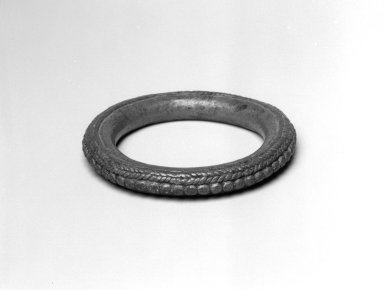 Dan. <em>Bracelet</em>, 19th century. Copper alloy, 1/2 x 4 x 4 in. (1.3 x 10.2 x 10.2 cm). Brooklyn Museum, Gift of Blake Robinson, 2004.52.12. Creative Commons-BY (Photo: Brooklyn Museum, 2004.52.12_bw.jpg)