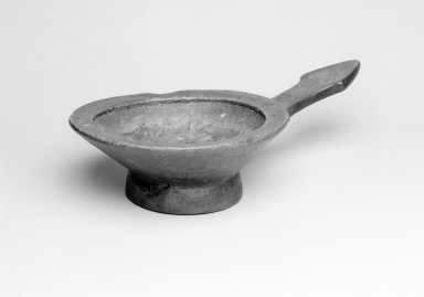 Somali. <em>Pedestal Bowl with Handle (Karbun)</em>, early 20th century. Wood, 3 1/16 x 14 1/4 x 8 in. (7.8 x 36.2 x 20.3 cm). Brooklyn Museum, Gift of Blake Robinson, 2004.76.6. Creative Commons-BY (Photo: Brooklyn Museum, 2004.76.6_bw.jpg)