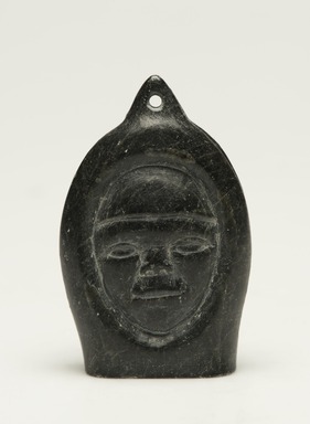 Samwillie Amidlak (1902–1984). <em>Janus-faced Amulet Head</em>, 1950–1980. Black stone, 2 3/4 x 1 7/8 x 3/4 in. (7 x 4.8 x 1.9 cm). Brooklyn Museum, Hilda and Al Schein Collection, 2004.79.19. Creative Commons-BY (Photo: Brooklyn Museum, 2004.79.19_view01_PS11-1.jpg)