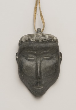 Therese Ukaleannuk (Inuit). <em>Amulet in the Form of a Head, March 1974</em>, 1950-1980. Gray stone, rawhide, 2 3/4 x 1 3/4 x 3/4 in. (7 x 4.4 x 1.9 cm). Brooklyn Museum, Hilda and Al Schein Collection, 2004.79.27. Creative Commons-BY (Photo: Brooklyn Museum, 2004.79.27_PS11-1.jpg)