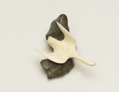 Inuit. <em>Loon on a Rock</em>, 1950–1980. Ivory, gray stone, 1 1/2 x 2 1/2 x 2 5/8 in. (3.8 x 6.4 x 6.7 cm). Brooklyn Museum, Hilda and Al Schein Collection, 2004.79.61. Creative Commons-BY (Photo: Brooklyn Museum, 2004.79.61_view01_PS11-1.jpg)