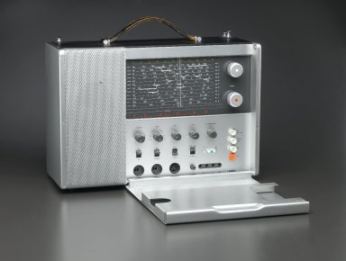 Dieter Rams (German, born 1932). <em>World Receiver T 1000 Radio</em>, 1963. Aluminum, plastic, leather, 14 1/4 x 5 1/4 in. (36.2 x 13.3 cm). Brooklyn Museum, Gift of Jan Staller, 2006.9. Creative Commons-BY (Photo: Brooklyn Museum, 2006.9_open_PS1.jpg)