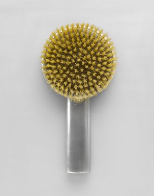 Queens Art Pewter, Ltd. (1930-2000). <em>Brush</em>, ca. 1935. Pewter, bristles, cellulous, 8 5/8 x 4 3/8 x 1 1/2 in. (21.9 x 11.1 x 3.8 cm). Brooklyn Museum, Bequest of H. Randolph Lever, by exchange, 2007.21.3. Creative Commons-BY (Photo: Brooklyn Museum, 2007.21.3_front_PS6.jpg)