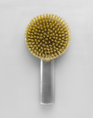 Queens Art Pewter, Ltd. (1930–2000). <em>Brush</em>, ca. 1935. Pewter, bristles, cellulous, 8 5/8 x 4 3/8 x 1 1/2 in. (21.9 x 11.1 x 3.8 cm). Brooklyn Museum, Bequest of H. Randolph Lever, by exchange, 2007.21.3. Creative Commons-BY (Photo: Brooklyn Museum, 2007.21.3_front_PS6.jpg)