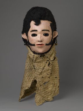 Chewa. <em>'Elvis' Mask for Nyau Society</em>, ca. 1977. Wood, paint, fiber, cloth, 11 x 9 1/2 x 7 1/4 in. (27.9 x 24.1 x 18.4 cm). Brooklyn Museum, Gift of Mr. and Mrs. J. Gordon Douglas III, Frederick E. Ossorio, and Elliot Picket, by exchange and Designated Purchase Fund, 2010.41. Creative Commons-BY (Photo: Brooklyn Museum, 2010.41_PS6.jpg)