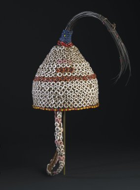 Lega. <em>Bwami Hat for Kindi Level</em>, early 20th century. Plant fiber, buttons, glass beads, elephant tail hair
, 15 1/2 x 6 1/2 in. (39.4 x 16.5 cm). Brooklyn Museum, Designated Purchase Fund, 2011.3.1. Creative Commons-BY (Photo: Brooklyn Museum, 2011.3.1_PS6.jpg)