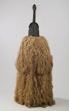 Gola. <em>Helmet Mask (Gbetu) with Raffia Costume</em>, early to mid 20th century. Wood, pigment, metal, raffia, 93 x 48 in. (236.2 x 121.9 cm). Brooklyn Museum, Gift of William C. Siegmann, 2011.53.1a-b. Creative Commons-BY (Photo: Brooklyn Museum, 2011.53.1a-b_PS6.jpg)