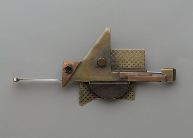 Peter Macchiarini (American, 1909-2001). <em>Brooch</em>, ca. 1955. Brass, copper, silver, wood, ivory (?), 4 3/4 x 2 1/4 x 3/4 in. (12.1 x 5.7 x 1.9 cm). Brooklyn Museum, Gift of Mrs. H. A. Metzger, by exchange, 2012.33. Creative Commons-BY (Photo: Brooklyn Museum, 2012.33_PS9.jpg)