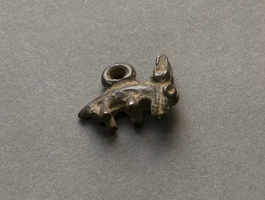 Senufo. <em>Animal Pendant</em>, early 20th century. Bronze, 5/8 x 7/8 x 3/8 in. (1.6 x 2.3 x 1 cm). Brooklyn Museum, Gift of Jerome Vogel, 2012.76.18. Creative Commons-BY (Photo: Brooklyn Museum, 2012.76.18_PS10.jpg)