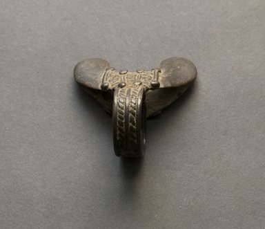 Senufo. <em>Flanged Ring</em>, early 20th century. Bronze, 1 5/8 x 7/8 x 1 5/8 in. (4.1 x 2.2 x 4.1 cm). Brooklyn Museum, Gift of Jerome Vogel, 2012.76.26. Creative Commons-BY (Photo: Brooklyn Museum, 2012.76.26_PS10.jpg)