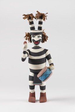 Hopi Pueblo. <em>Koyaala Tihu (Tewa Clown Kachina Doll)</em>, late 20th century. Cottonwood, plant fibers, fabric, paint, cord, 15 &times; 5 1/4 &times; 7 in. (38.1 &times; 13.3 &times; 17.8 cm). Brooklyn Museum, Gift of Joan and Sanford Krotenberg, 2013.64.11. Creative Commons-BY (Photo: Brooklyn Museum, 2013.64.11_front_PS22.jpg)