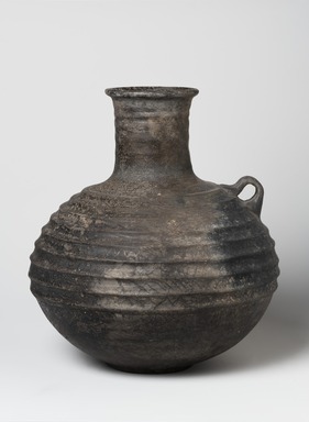  <em>Ribbed Jug</em>, 1st millennium B.C.E. Clay, slip, height: 10 5/8 in. (27 cm). Brooklyn Museum, Gift of the Arthur M. Sackler Foundation, NYC, in memory of James F. Romano, 2015.65.2. Creative Commons-BY (Photo: Brooklyn Museum, 2015.65.2_view01_PS11.jpg)