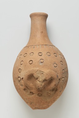  <em>Bottle with Ram or Buffalo Head</em>, 3rd-7th century C.E. Clay, 8 3/8 x Diam. 5 3/16 in. (21.3 x 13.1 cm). Brooklyn Museum, Gift of the Arthur M. Sackler Foundation, NYC, in memory of James F. Romano, 2015.65.4. Creative Commons-BY (Photo: Brooklyn Museum, 2015.65.4_PS11.jpg)