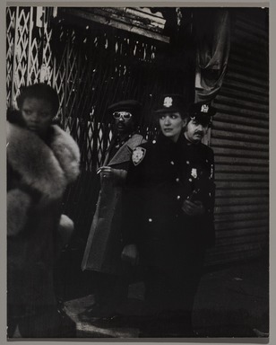 Fred McDarrah (1926–2007, American, b. Brooklyn, NY). <em>Cops on 8th Ave, December 21, 1974</em>, 12/21/1974. Gelatin silver print (vintage), sheet: 8 × 10 in. (20.3 × 25.4 cm). Brooklyn Museum, Gift from the Goldman-Sonnenfeldt Family, 2023.69.8. © artist or artist's estate (Photo: Brooklyn Museum, 2023.69.8_PS11.jpg)