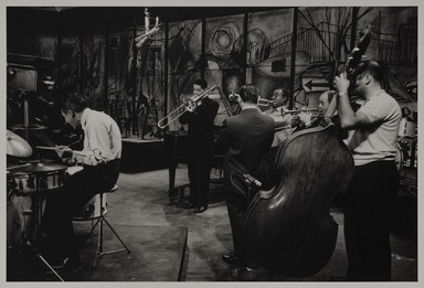 Milt Hinton (born Vicksburg Mississippi, active Chicago, IL, 1910–2000). <em>Gene Krupa, Trummy Young, Peanuts Hucko, Louis Armstrong, Bobbie Hackett, and Mort Herbert, television studio, N.Y.C.</em>, 1959. Gelatin silver print, 11 × 14 in. (27.9 × 35.6 cm). Brooklyn Museum, Gift of David Berger and Holly Maxson, 2023.80.14 (Photo: Brooklyn Museum, 2023.80.14_PS20.jpg)