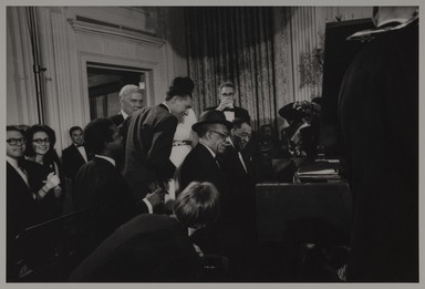 Milt Hinton (born Vicksburg Mississippi, active Chicago, IL, 1910–2000). <em>Leonard Feather, Willie ”The Lion” Smith, Duke Ellington, and Henry Kissinger, The White House, Washington, DC</em>, 1969. Gelatin silver print, 11 × 14 in. (27.9 × 35.6 cm). Brooklyn Museum, Gift of David Berger and Holly Maxson, 2023.80.15 (Photo: Brooklyn Museum, 2023.80.15_PS20.jpg)