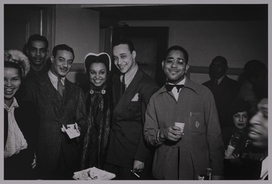 Milt Hinton (born Vicksburg Mississippi, active Chicago, IL, 1910–2000). <em>Lois Miller, Cholly Atkins, Donald Mills, Avis Andrews, Louis Brown, Dizzy Gillespie, and Keg Johnson, backstage, Earle Theater, Philadelphia</em>, ca. 1939. Gelatin silver print, 11 × 14 in. (27.9 × 35.6 cm). Brooklyn Museum, Gift of David Berger and Holly Maxson, 2023.80.2 (Photo: Brooklyn Museum, 2023.80.2_PS20.jpg)