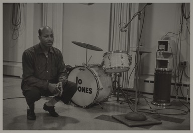 Milt Hinton (born Vicksburg Mississippi, active Chicago, IL, 1910–2000). <em>Jo Jones, recording studio, N.Y.C., c. 1956 (w/ bass drums)</em>, ca. 1956. Gelatin silver print, 11 × 14 in. (27.9 × 35.6 cm). Brooklyn Museum, Gift of David Berger and Holly Maxson, 2023.80.8 (Photo: Brooklyn Museum, 2023.80.8_PS20.jpg)