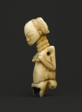 Luba. <em>Pendant</em>, 19th century. Hippopotamus tooth, 3 3/4 x 1 x 1 1/4 in. (9.5 x 2.5 x 3.2 cm). Brooklyn Museum, Museum Expedition 1922, Robert B. Woodward Memorial Fund, 22.1235. Creative Commons-BY (Photo: Brooklyn Museum, 22.1235_PS2.jpg)