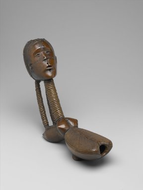 Ngbaka. <em>Anthropomorphic Pipe (Boka)</em>, late 19th or early 20th century. Wood, copper alloy, iron, vegetable material, 10 3/4 x 3 x 6 3/4in. (27.3 x 7.6 x 17.1cm). Brooklyn Museum, Museum Expedition 1922, Robert B. Woodward Memorial Fund, 22.1245. Creative Commons-BY (Photo: Brooklyn Museum, 22.1245_PS2.jpg)