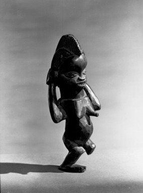 Mbala. <em>Figure of a Standing Female (Pindi)</em>, late 19th or early 20th century. Wood, 7 1/2 x 3 x 3 in. (18.8 x 7.5 x 7.5 cm). Brooklyn Museum, Museum Expedition 1922, Robert B. Woodward Memorial Fund, 22.134. Creative Commons-BY (Photo: Brooklyn Museum, 22.134_acetate_bw.jpg)