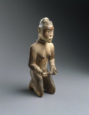 Yombe. <em>Kneeling Woman Holding a Pipe</em>, 19th century. Wood, pigment, glass mirror, fiber, copper alloy, 9 13/16 x 3 15/16 x 3 3/4 in. (25 x 10 x 9.5 cm). Brooklyn Museum, Museum Expedition 1922, Robert B. Woodward Memorial Fund, 22.1426. Creative Commons-BY (Photo: Brooklyn Museum, 22.1426_edited_version_SL1.jpg)