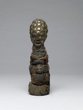 Songye. <em>Power Figure (Nkishi)</em>, 19th century. Wood, glass beads, fiber, cloth, copper alloy, 8 1/2 x 2 3/8 in. (21.5 x 6.0 cm). Brooklyn Museum, Museum Expedition 1922, Robert B. Woodward Memorial Fund, 22.1460. Creative Commons-BY (Photo: Brooklyn Museum, 22.1460_front_PS6.jpg)