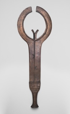 Ngbaka. <em>Double Sickle Blade (Bango or Bwagogambanza)</em>, late 19th or early 20th century. Copper alloy, wire, 7 5/16 x 20 11/16 in. (18.5 x 52.5 cm). Brooklyn Museum, Museum Expedition 1922, Robert B. Woodward Memorial Fund, 22.1502. Creative Commons-BY (Photo: Brooklyn Museum, 22.1502_PS11.jpg)