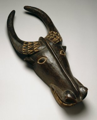 Bamenda. <em>Bush Cow Mask</em>, late 19th century. Wood, pigment, 28 3/8 x 10 5/8 x 5 3/4 in. (72.1 x 27.0 x 14.6 cm). Brooklyn Museum, Museum Expedition 1922, Robert B. Woodward Memorial Fund, 22.1587. Creative Commons-BY (Photo: Brooklyn Museum, 22.1587_SL1.jpg)