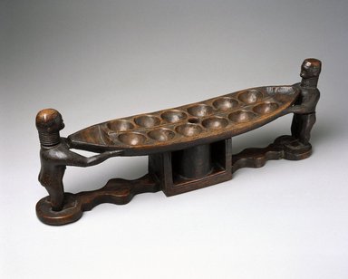 Possibly Bullom. <em>Mancala Game Board</em>, 19th century. Wood, 8 1/4 x 23 1/4 x 5 1/8 in. (21 x 59.1 x 13 cm). Brooklyn Museum, Museum Expedition 1922, Robert B. Woodward Memorial Fund, 22.239. Creative Commons-BY (Photo: Brooklyn Museum, 22.239_SL1.jpg)