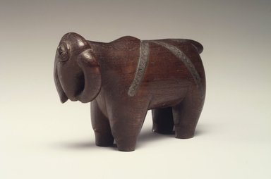 Possibly Zulu. <em>Snuff Container in Form of a Buffalo</em>, 19th century. Wood, metal, 2 1/2 x 6 1/4 x 1 1/2 in.  (6.4 x 15.9 x 3.8 cm). Brooklyn Museum, Gift of Thomas A. Eddy, 22.809. Creative Commons-BY (Photo: Brooklyn Museum, 22.809.jpg)