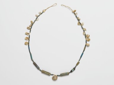  <em>Necklace</em>, ca. 2008-1630 B.C.E. Faience, shell (marine Cypraea moneta and Xeropicta vestalis), 1/2 x 1/4 x 19 1/8 in. (1.3 x 0.6 x 48.6 cm). Brooklyn Museum, Gift of the Egypt Exploration Society, 26.167. Creative Commons-BY (Photo: Brooklyn Museum, 26.167_PS2.jpg)