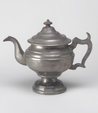 Unknown. <em>Teapot</em>, mid–19th century. Pewter, wood, 8 3/8 x 10 1/4 x 5 3/4 in. (21.3 x 26 x 14.6 cm). Brooklyn Museum, Gift of Mrs. Samuel Doughty, 27.457. Creative Commons-BY (Photo: Brooklyn Museum, 27.457.jpg)