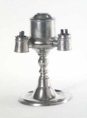 Yale and Curtis. <em>Lamp</em>, 1858–1867. Pewter, Overall: 8 1/4 x 5 1/4 x 5 in. (21 x 13.3 x 12.7 cm). Brooklyn Museum, Gift of Mrs. Samuel Doughty, 27.527. Creative Commons-BY (Photo: Brooklyn Museum, 27.527_transp934.jpg)