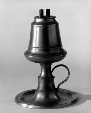 Fuller & Smith. <em>Lamp</em>, ca. 1851. Pewter, metal, 5 3/4 x 4 x 4 in. (14.6 x 10.2 x 10.2 cm). Brooklyn Museum, Gift of Mrs. Samuel Doughty, 27.583. Creative Commons-BY (Photo: Brooklyn Museum, 27.583_bw.jpg)