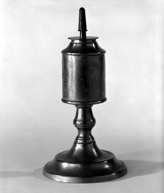 Capen and Molineux. <em>Lamp</em>, 1848-1854. Pewter, copper (?), 7 1/4 x 3 3/4 x 3 3/4 in. (18.4 x 9.5 x 9.5 cm). Brooklyn Museum, Gift of Mrs. Samuel Doughty, 27.586. Creative Commons-BY (Photo: Brooklyn Museum, 27.586_bw.jpg)