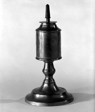 Capen and Molineux. <em>Lamp</em>, 1848–1854. Pewter, copper (?), 7 1/4 x 3 3/4 x 3 3/4 in. (18.4 x 9.5 x 9.5 cm). Brooklyn Museum, Gift of Mrs. Samuel Doughty, 27.586. Creative Commons-BY (Photo: Brooklyn Museum, 27.586_bw.jpg)