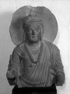 Graeco-Buddhistic. <em>Upper Part of a Bodhisattva Figure</em>, ca. 2nd-3rd century C.E. Blackish-gray slate, 50 x 35 x 11.5 cm (50 x 35 x 11.5 cm). Brooklyn Museum, Gift of Frederic B. Pratt, 27.70. Creative Commons-BY (Photo: Brooklyn Museum, 27.70_glass_bw.jpg)
